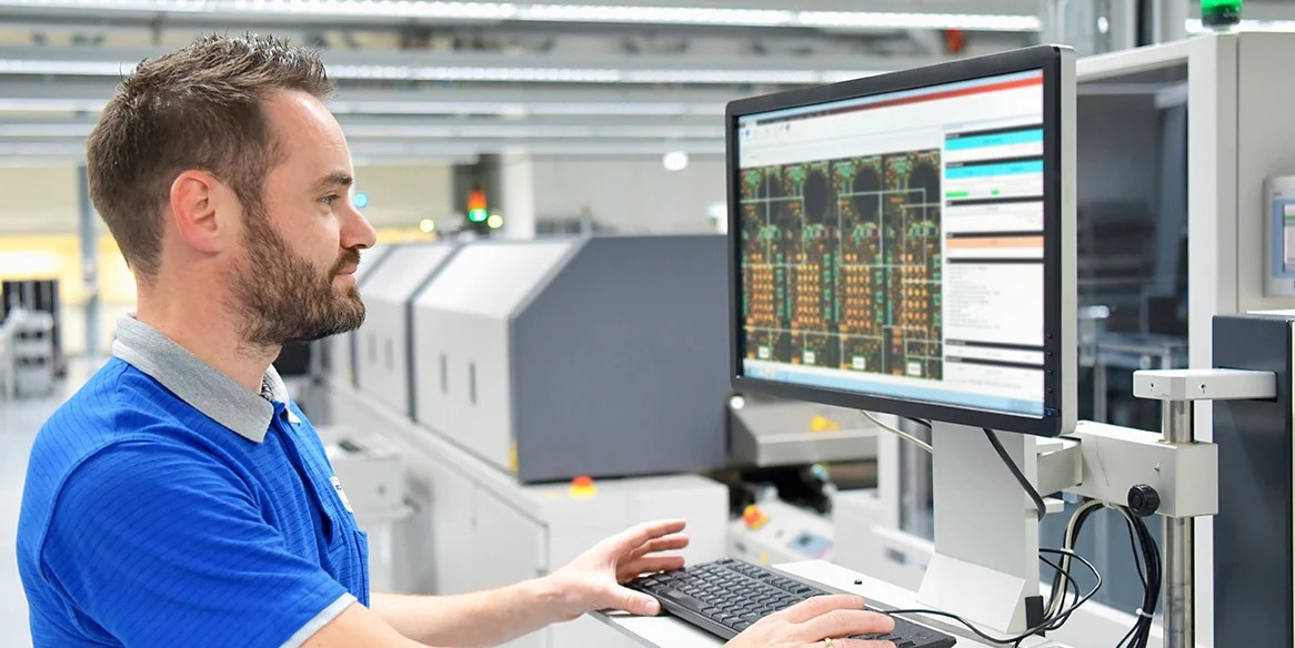 Automation engineer testing PLC program