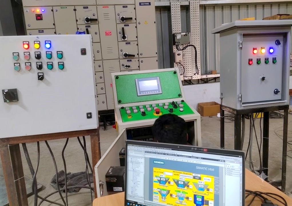 Ladder logic program open in PLC programming software on a laptop